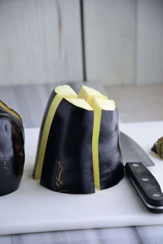 Eggplant being sliced for eggplant fries.