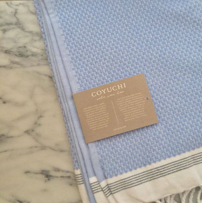 These organic Coyuchi towels are so incredibly soft and beautiful; they're a gorgeous blue and they're shown here laid out over a marble table. The best organic duvet covers are one of Coyuchi's best signature pieces.