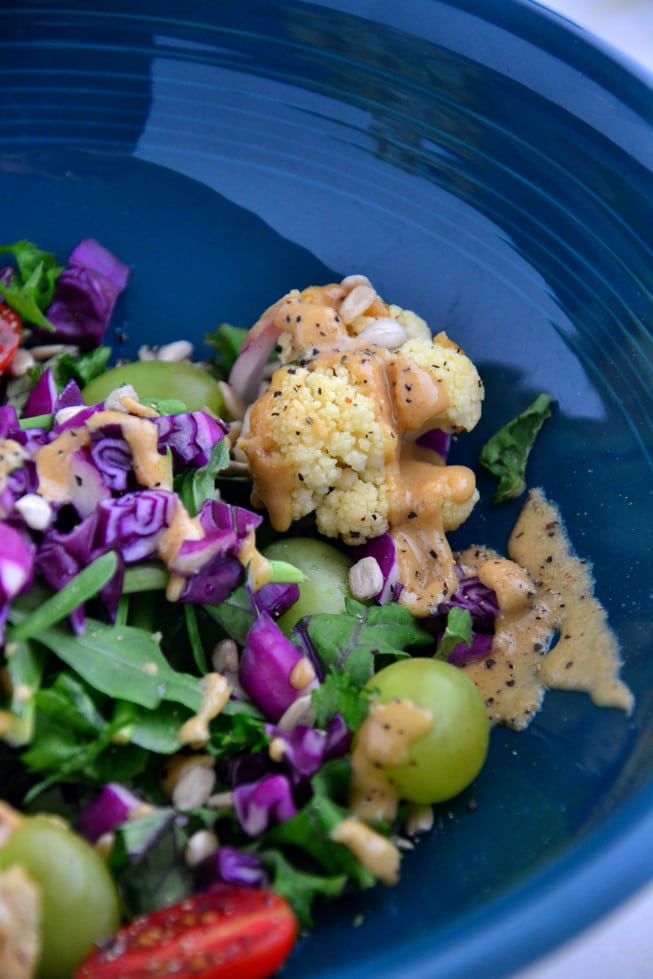 This Detox Salad with Kale is loaded with roasted cauliflower, tomatoes, grapes and other detoxifying veggies.