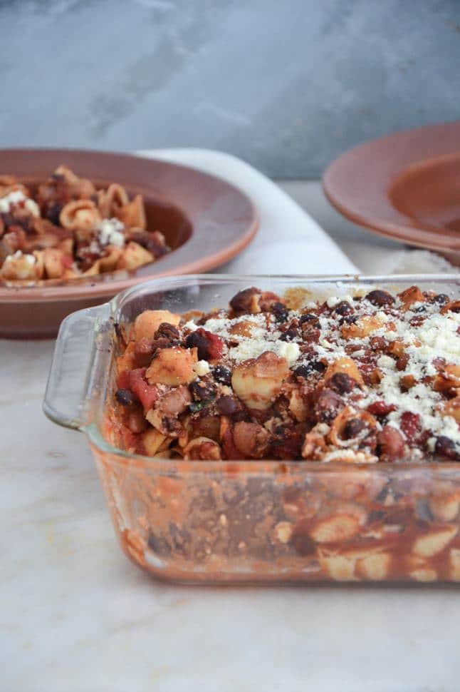 A baked gluten free pasta casserole with plate.