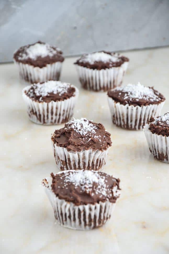 Gluten free chocolate cupcakes with coconut on top.