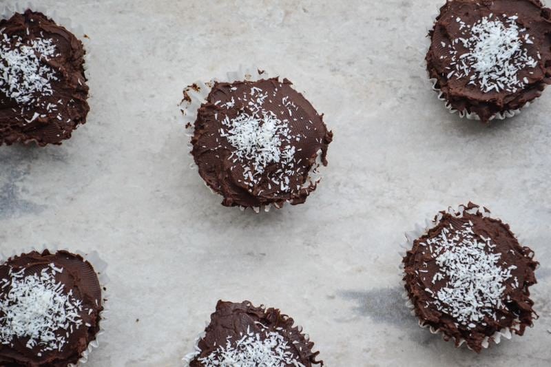 Gluten free cupcakes topped with dairy-free chocolate icing.