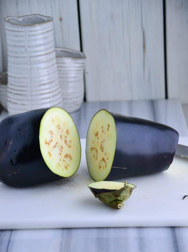 Eggplant split in half for the start of eggplant fries.