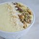 Mango Tango Smoothie bowl with coconut and nuts and seeds.