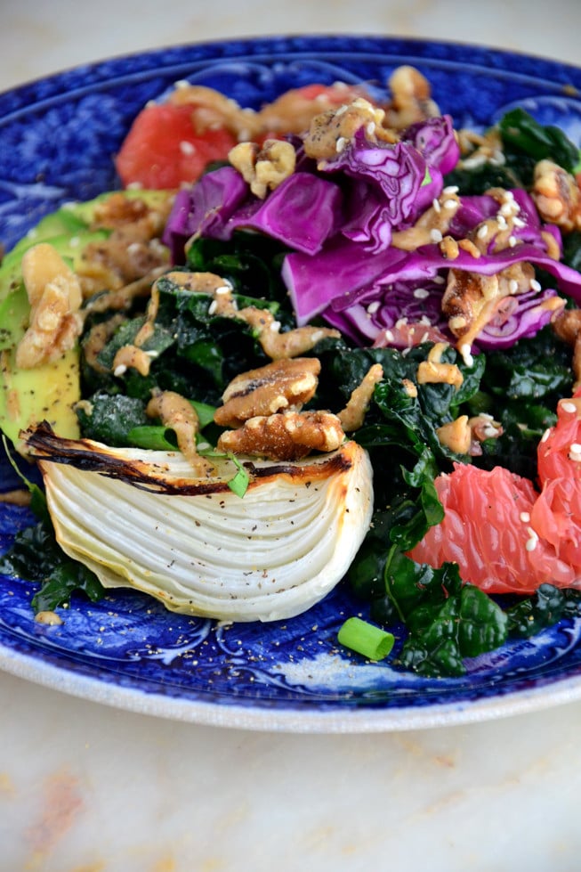 Roasted sweet onions with massaged kale avocado salad drizzled with a creamy almond dressing for a quick lunch or dinner!