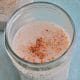 A delicious recipe for dairy-free eggnog in a beautiful le parfait glass.