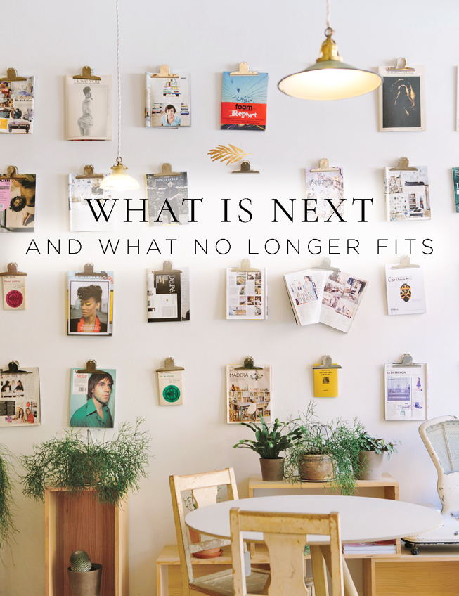 What is next and what no longer fits room filled with beautiful photos on the walls and a wooden table.